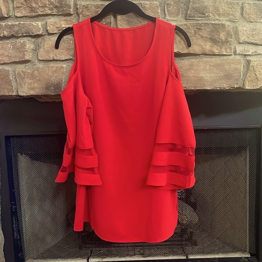 Red, cold shoulder with partially sheer sleeves. Small